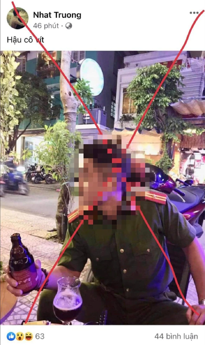 Bị phạt vì mặc đồ công an, cầm chai bia chụp hình rồi đăng lên Facebook - Ảnh 1.